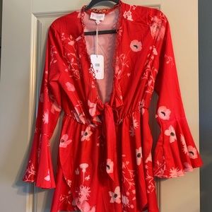 New, with tags. Super cute romper. Size small.